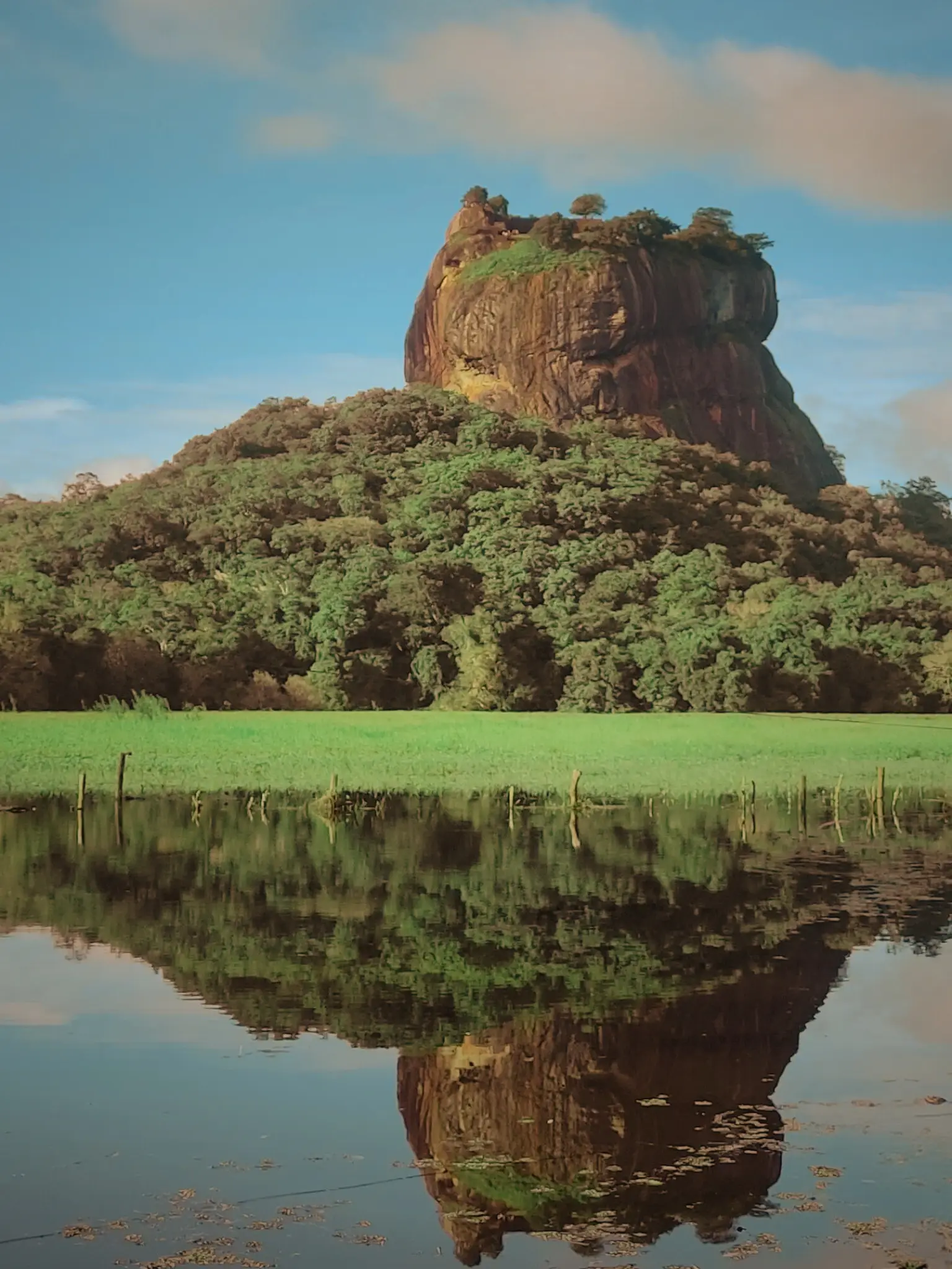 Sigirya rock fortress reflection on lake